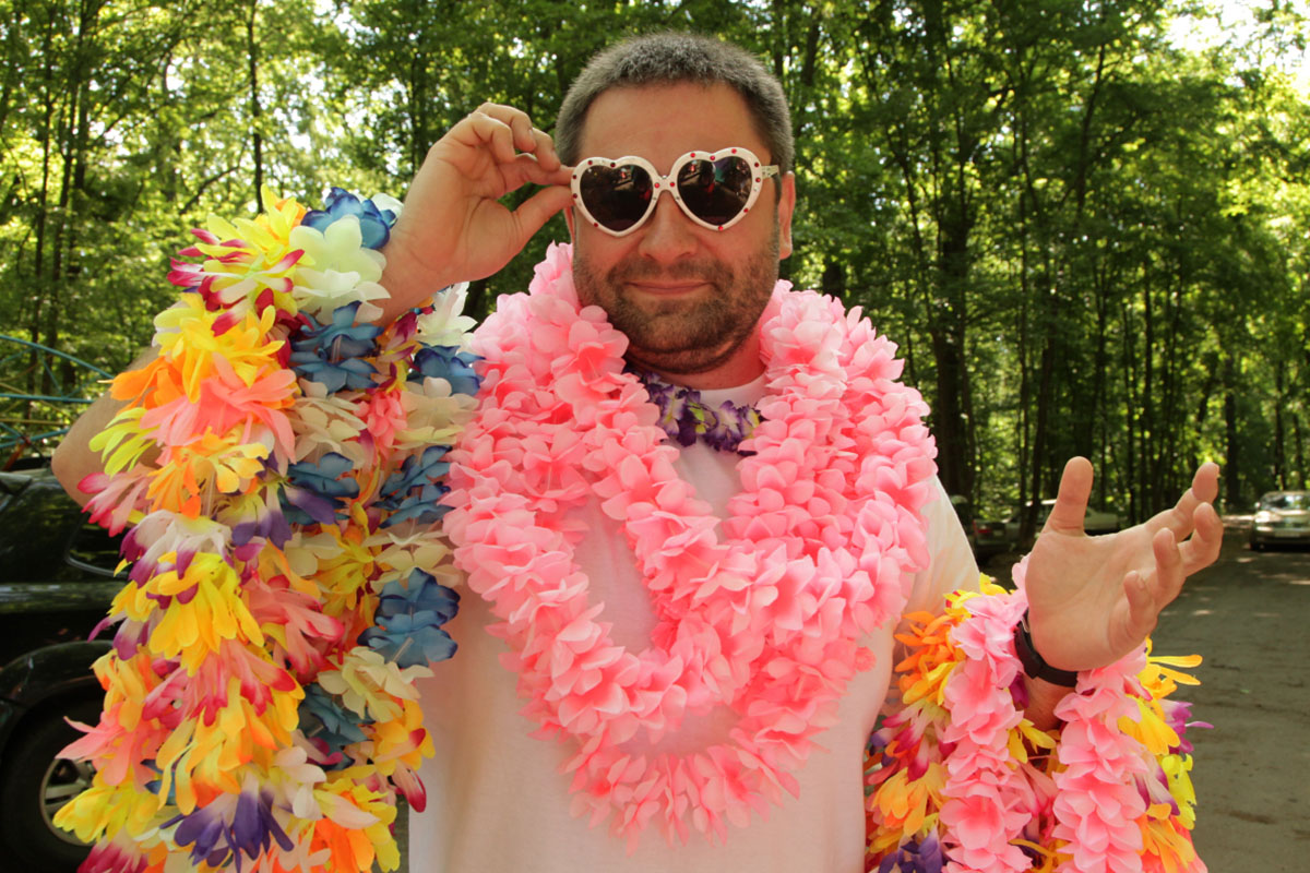 Man in Colorful Leis and Sunglasse