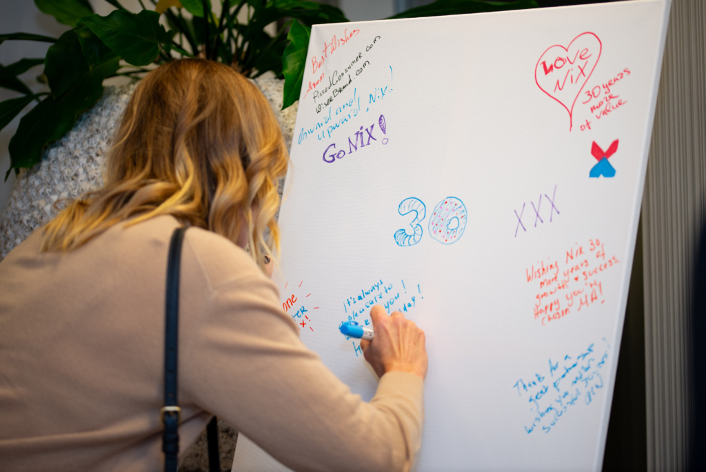 Writing Wishes On NIX Celebration Board